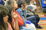 Latina students learning about the Digital Divide