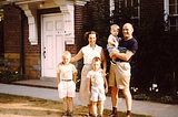 Picture of generic family from 1950s, husband, wife and three kids