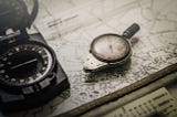 Photo of a map and compass.