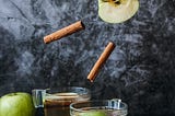 sliced apples in a glass with cinnamon