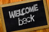 a chalk board that says welcome back