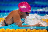 2015 world swimming championships. Swimmer doing breaststroke in pink hat