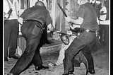 A black man being beaten by police