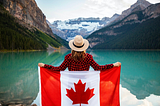 A person holding Canada’s flag