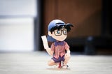 Detective Conan ffigurine holding a piece of paper