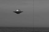 A classic black and white photo of a flying saucer over the ocean, like one from an old Hollywood UFO movie.