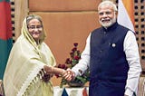 an image of former prime minister of Bangladesh Sheikh Hasina and her counterpart Narendra Modi shaking hands.