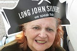 Woman wearing a Long John Silver’s hat.