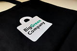 Returnable bag with big green company logo