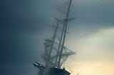 AI-generated image of a sailing ship on the ocean under a threatening sky.