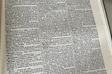 Picture of a page from the Shorter Oxford English dictionary with tiny print