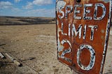 A rusted speed limit sign in the middle of nowhere