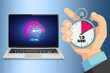 A laptop displaying a performance meter at 100Mb and a person’s hand holding a stop watch with the arm on the 10 minute mark.