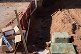 hole dug to set a foundation for an addition