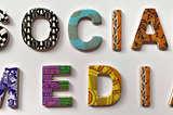 colourful ceramic letters forming the words: Social Media