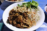 Happiness is a bowl of bún chả in the rain