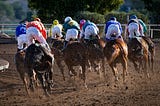 Horses racing.