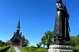 A photo of the statue of Evangeline, in front of the Stone Church at Grand Pré, Nova Scotia.