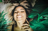 cheerful-woman-resting-in-plant-nursery