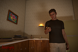 A man stares dejectedly at a lime in his hand, standing in a dingy apartment kitchenette.