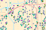 A screenshot of a mapping tool with dots of various colors superimposed on a Chicago neighborhood