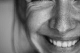 A close up of a woman smiling