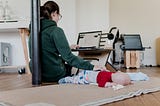 Mother working from home — with baby