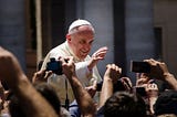 Pope Francis meeting people at St Peter’s Square, Vatican City State. Credit: Alfredo Borba / Wikimedia Commons