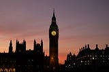A shot of the Elizabeth Tower, known as Big Ben, and the Houses of Parliament, at dusk.