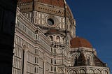 The grand Florence cathedral in the November sun, with an area cast in strong shade.