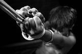 black and white picture of a woman tied on a rope