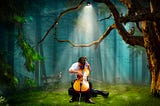 A young man sits alone playing a cello under a spotlight in the forest