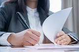 Picture of woman looking at forms