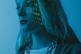 Women standing with boolean code projected on her face