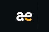 The author created this image of the letters ‘ae’ in white, lowercase script, with the aperture of the ‘e’ in mustard yellow, centered on a black background using Canva and Picsart.