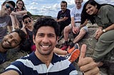 Picture of the author and six younger colleagues at a beach in Maine.