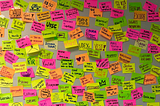 A wall with many post-it notes