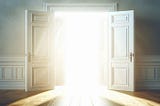 white doors open into a room filled with bright white light