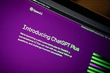 OpenAI’s website page showing company logo and introduction to ChatGPT Plus in bright green neon text on purple background.