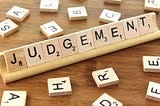 scrabble tiles spelling judgement