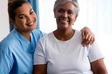 professional home health care aide with client