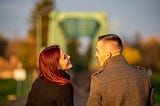 A young couple laughing, in love.