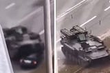 In a shocking video, a Russian tank smashes a Ukrainian car with a civilian inside