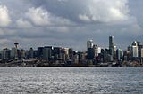 Seattle skyline as seen from the water, with Puget Sound in the foreground