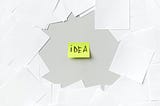 A word “idea” in a sticky notes with many white blank paper around it for the main picture in this article