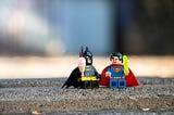Two lego figures of batman and superman