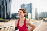 A woman out for a run in the city.