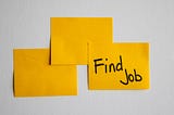 Stock photo of 3 yellow sticky notes. The third has the text “Find Job” written on it in sharpie.