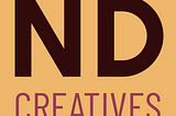 Simple logo that simply reads “ND CREATIVES” in dark and light purple letters with a very light orangey beige background.