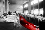 A black and white photo of an old hospital ward. A bright red river of blood courses between the beds. Dancing in the blood is Monopoly’s ‘Rich Uncle Pennybags.’ He has removed his face to reveal a grinning skull.